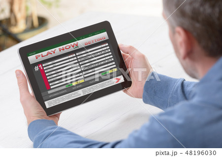 Man betting on sports Man betting on sports 48196030