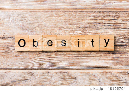 Obesity word written on wood block.  48196704