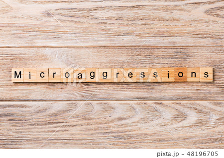 Microaggressions word written on wood block. Microaggressions word written on wood block. 48196705