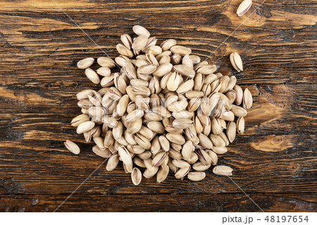 tasty pistachios lying on the table tasty pistachios lying on the table 48197654