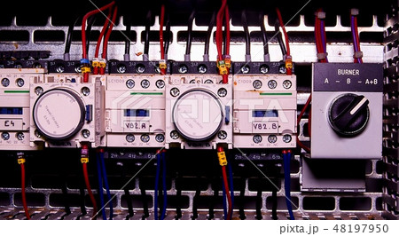 Image shows control cubicle. Electric device and circuit breakers inside power case 48197950