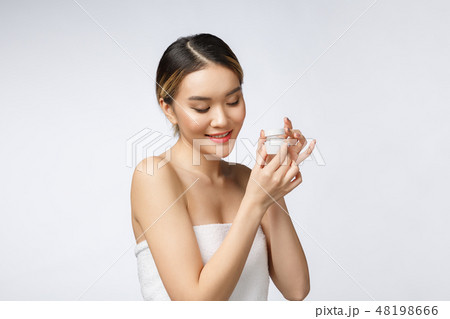 Beautiful Asia woman presenting product isolated on white background. COPY SPACE. 48198666