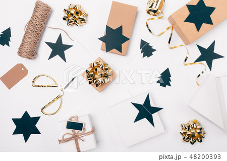 Top view of white table with Christmas gift boxes 48200393