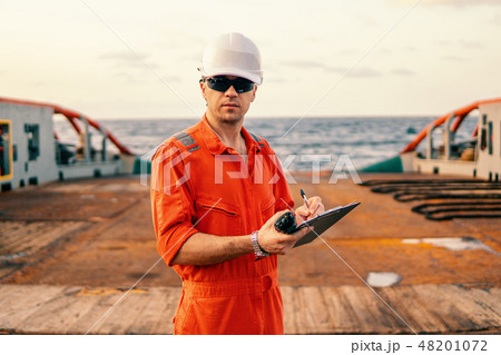 chief officer on deck of ship or vessel with checklist 48201072