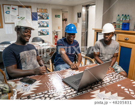 Seamen crew onboard a ship or vessel having fun watching movie Seamen crew onboard a ship or vessel having fun watching movie 48205831