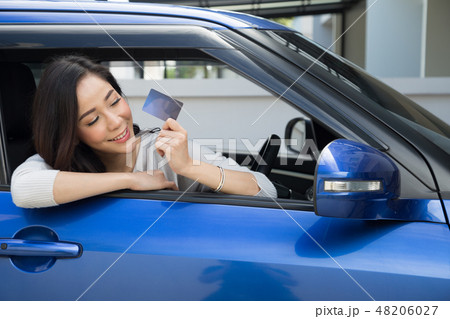 Asian woman holding and show credit card 48206027