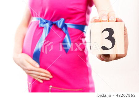 Hand of woman showing number of three 48207965