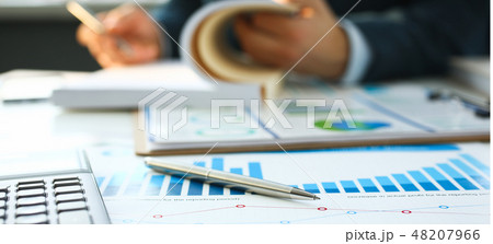 Silver calculator and financial statistics on clipboard Silver calculator and financial statistics on clipboard 48207966