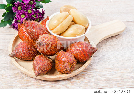 Salak Palm , waive or snake fruit in wooden dish. Salak Palm , waive or snake fruit in wooden dish. 48212331