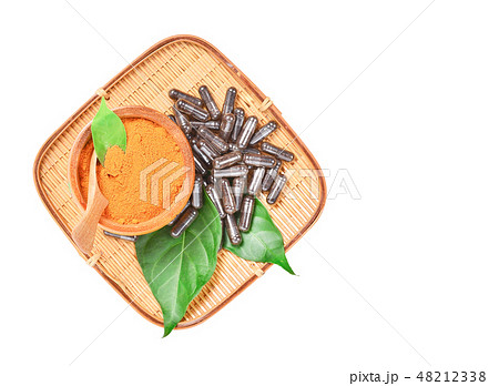 Natural medicine capsule pill with black herb. 48212338