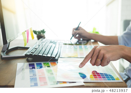 designer Editor at work drawing sketches a new project on graphi 48213937