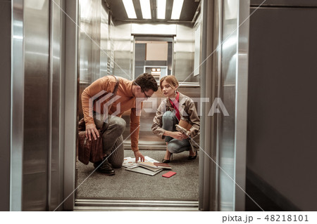 Blonde-haired wife feeling thankful while her man helping her 48218101