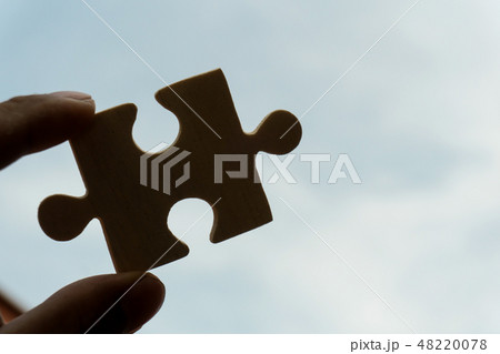 Hand team put missing jigsaw puzzle on the air 48220078