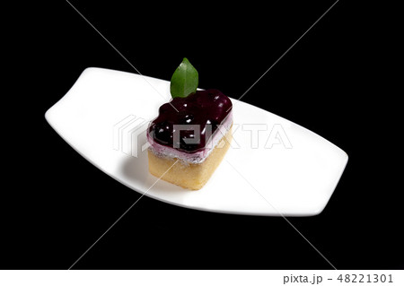 Sweet Cake on white dish Sweet Cake on white dish 48221301