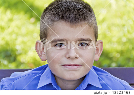 Cute brunette boy eleven years old 48223463
