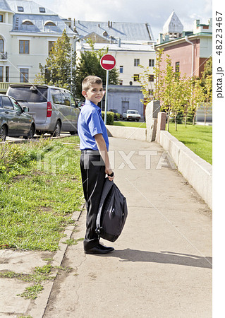 Boy are walking with school backpack 48223467