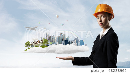 Woman presenting construction model Woman presenting construction model 48228962
