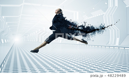 Dancing businesswoman in office Dancing businesswoman in office 48229489