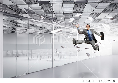 Dancing businessman in office 48229516