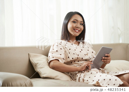 Pretty woman resting at home 48235341