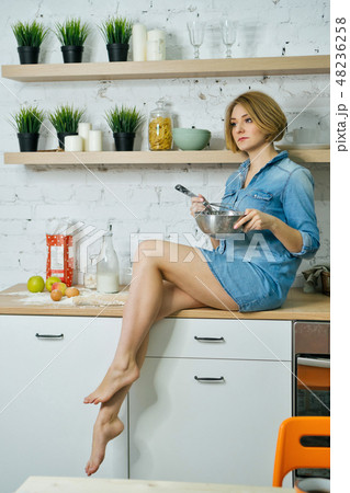 Girl preparing food in kitchen 48236258