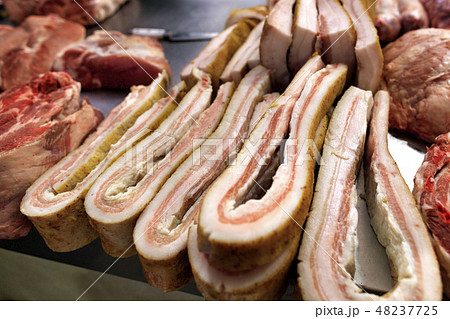 Fresh slices of bacon and meat lie on the market Fresh slices of bacon and meat lie on the market 48237725