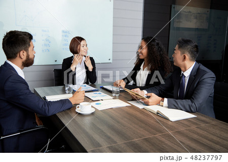 Smiling businesswoman explaining company perspectives 48237797