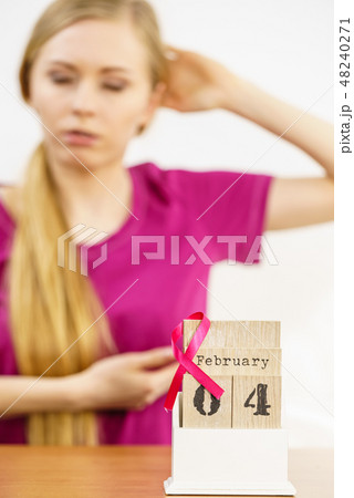 Woman and world breast cancer day on calendar Woman and world breast cancer day on calendar 48240271