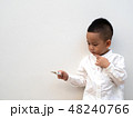sick boy with thermometer on white background 48240766