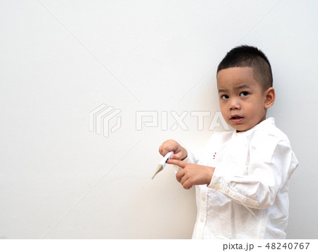 sick boy with thermometer on white background 48240767