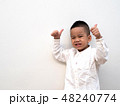 very happy asian boy making thumbs up sign 48240774