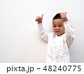 very happy asian boy making thumbs up sign  48240775