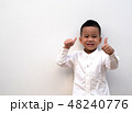 very happy asian boy making thumbs up sign  48240776