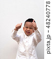 very happy asian boy making thumbs up sign 48240778