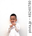 very happy asian boy making thumbs up sign 48240780