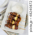 Beef skewers with onion and bacon Beef skewers with onion and bacon 48240872