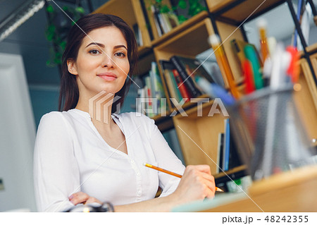 Pregnant business woman working at office motherhood sitting bottom view close-up 48242355