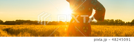 African woman in traditional clothes at sunset 48245091