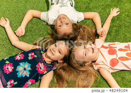 Group of happy children playing outdoors. 48249104