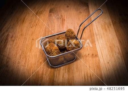 Meatballs on steel food basket 48251695