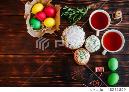 Easter cake and colorful eggs on a dark background Easter cake and colorful eggs on a dark background 48251899