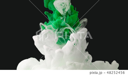 Green and white color paint drops in water Green and white color paint drops in water 48252456