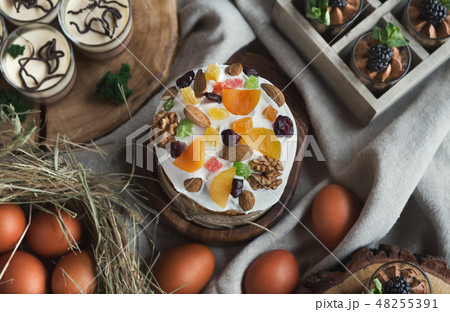 Easter cake with dried fruits and eggs top view 48255391