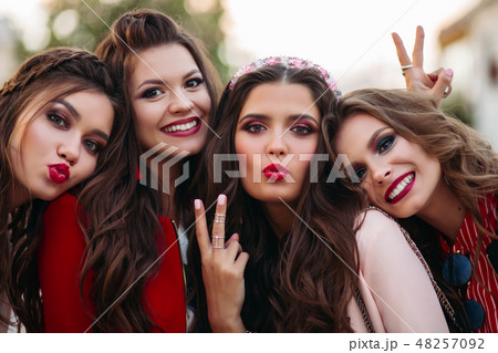 Group of gorgeous girlfriends smiling and 48257092