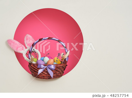 Background with colorful eggs in basket. 48257754