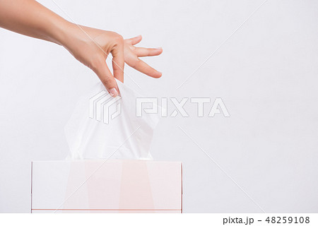 Healthcare Woman hand picking white tissue Healthcare Woman hand picking white tissue 48259108