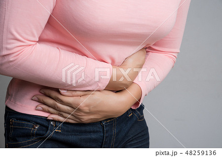Young woman having painful stomachache 48259136