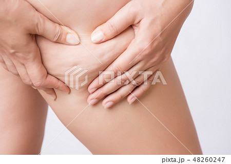Fat woman shows holding and pushing the skin Fat woman shows holding and pushing the skin 48260247