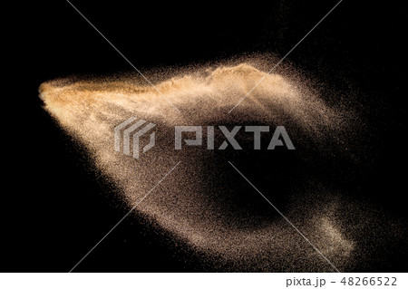 Golden sand explosion isolated on black background Golden sand explosion isolated on black background 48266522