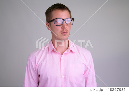 Face of young handsome nerd businessman thinking with eyeglasses 48267085